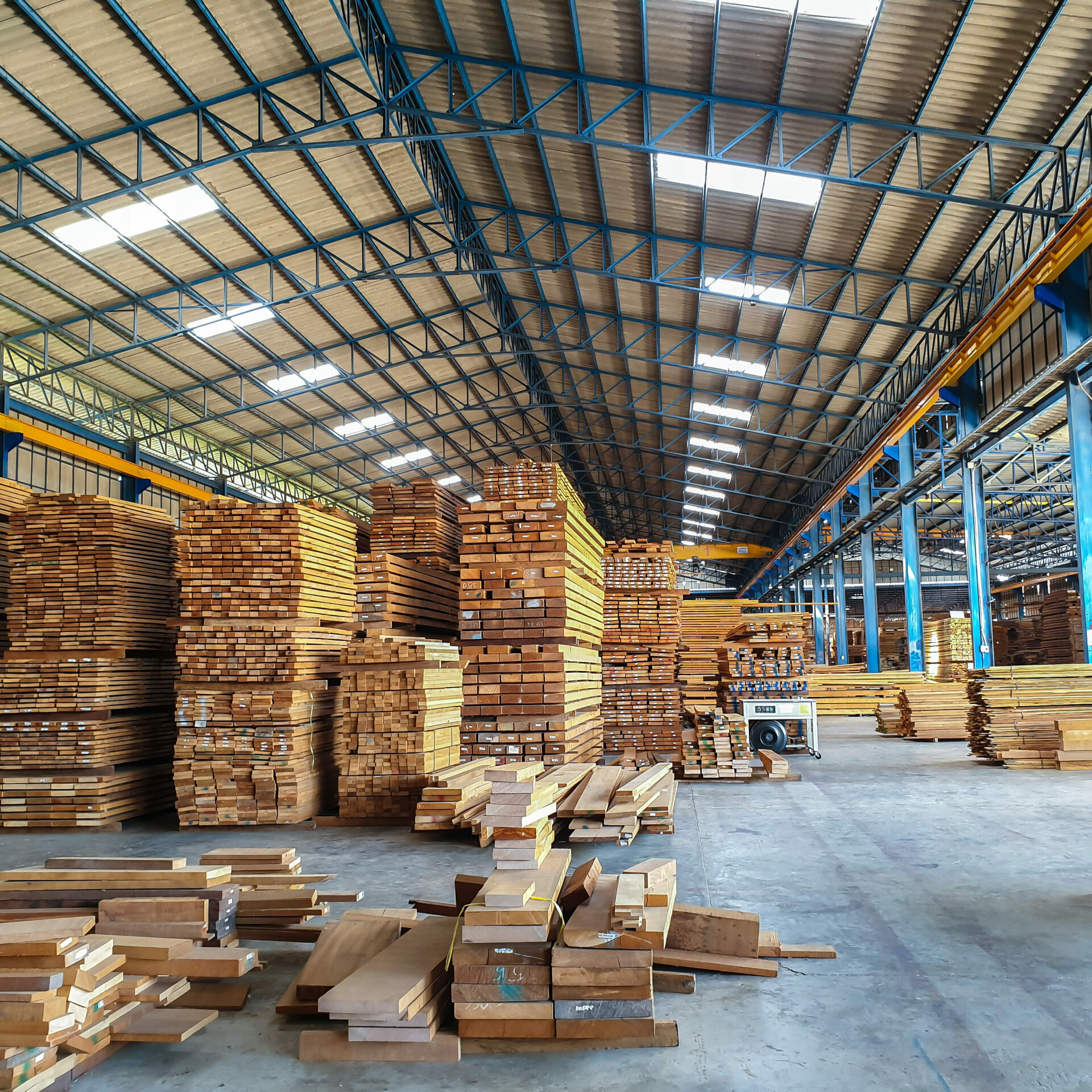 Lumber - Wood factory stock or timber in warehouse. ,Piles of woood
